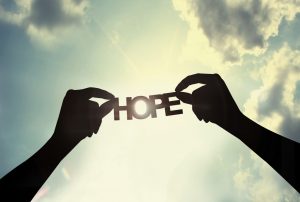 picture of the word hope held by two hands